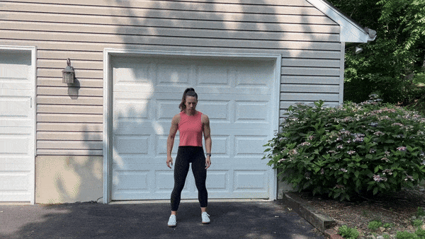 trainer doing lateral lunges outside in front of garage