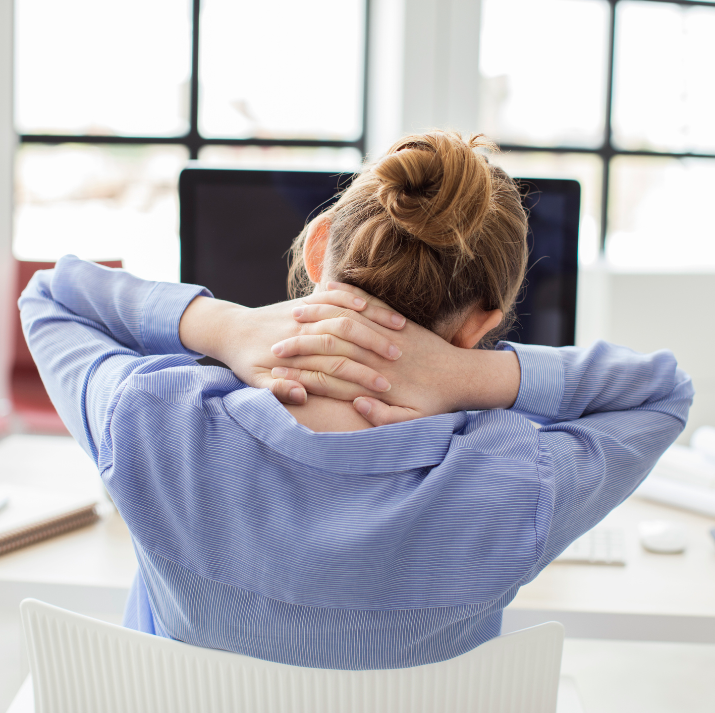 woman neck pain at desk