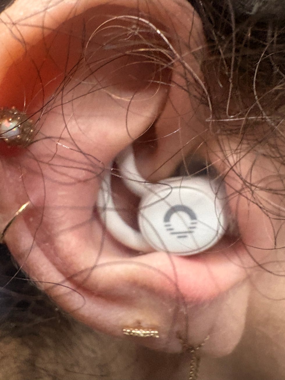 Ozlo Sleepbud earbud in an ear.