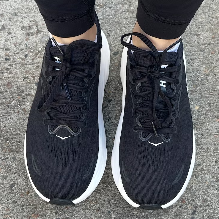 footwear on a concrete surface showcasing athletic shoes