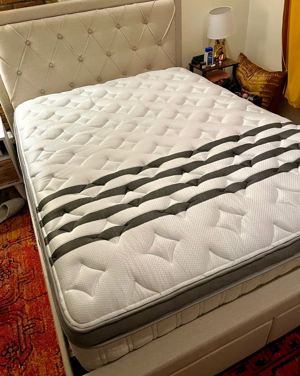 bed with a patterned mattress in a bedroom setting