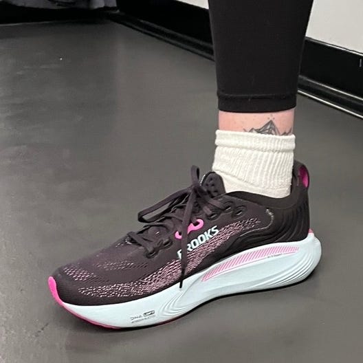 athletic shoes worn with black leggings and white socks