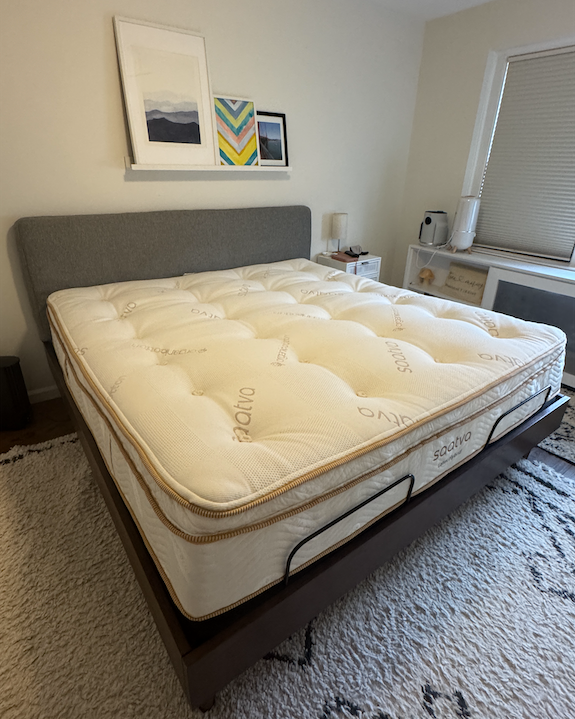 Queen-sized bed with a plush mattress in a simple bedroom.