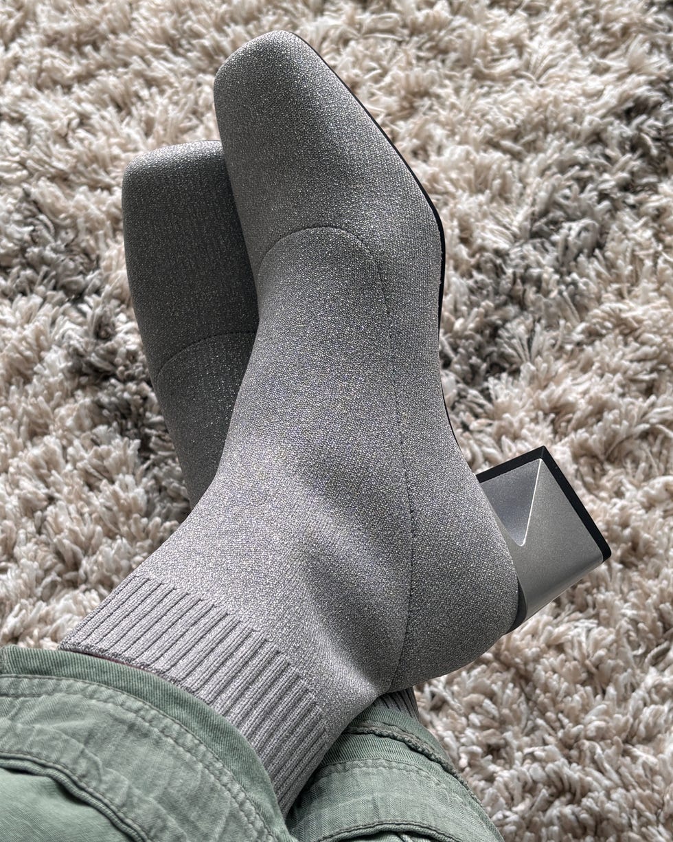 footwear featuring stylish gray socks and a block heel on a textured surface