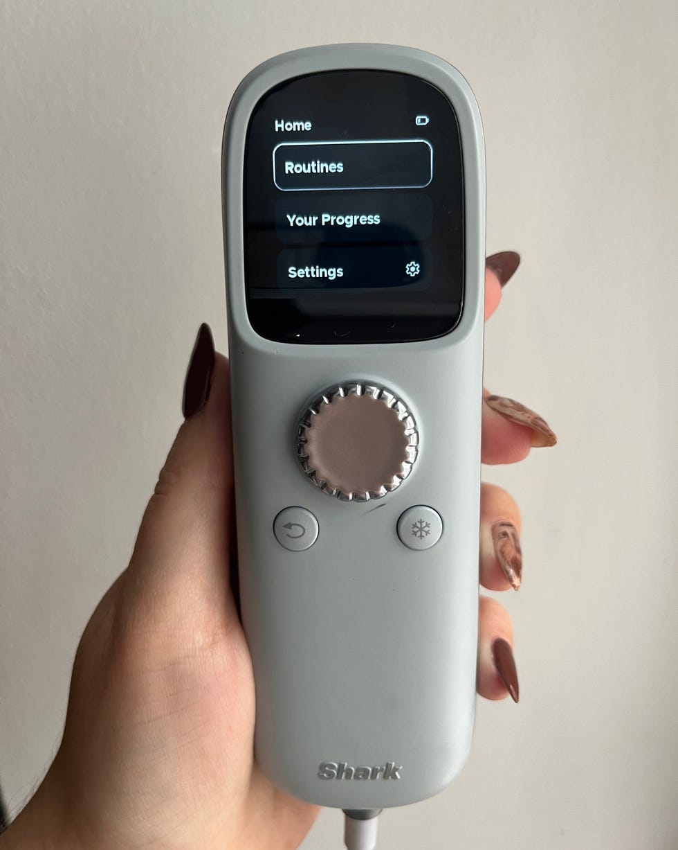 handheld control device with a screen and buttons