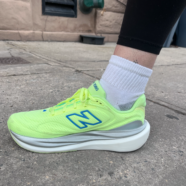 Bright athletic shoe against a concrete surface