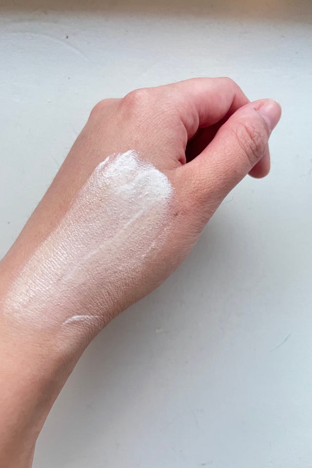 applying sunscreen on hand