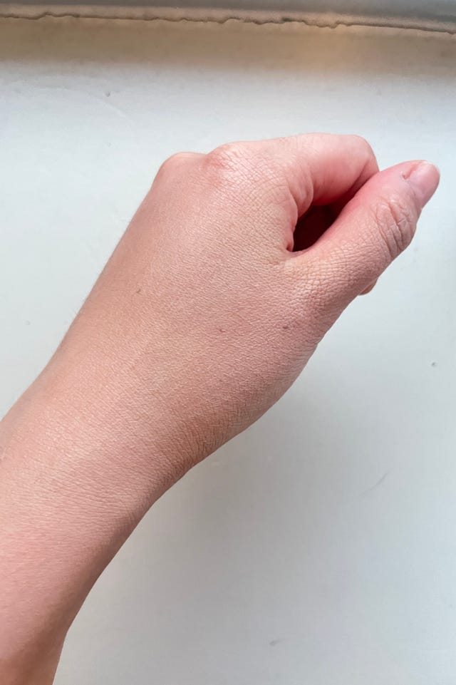 applying sunscreen on hand