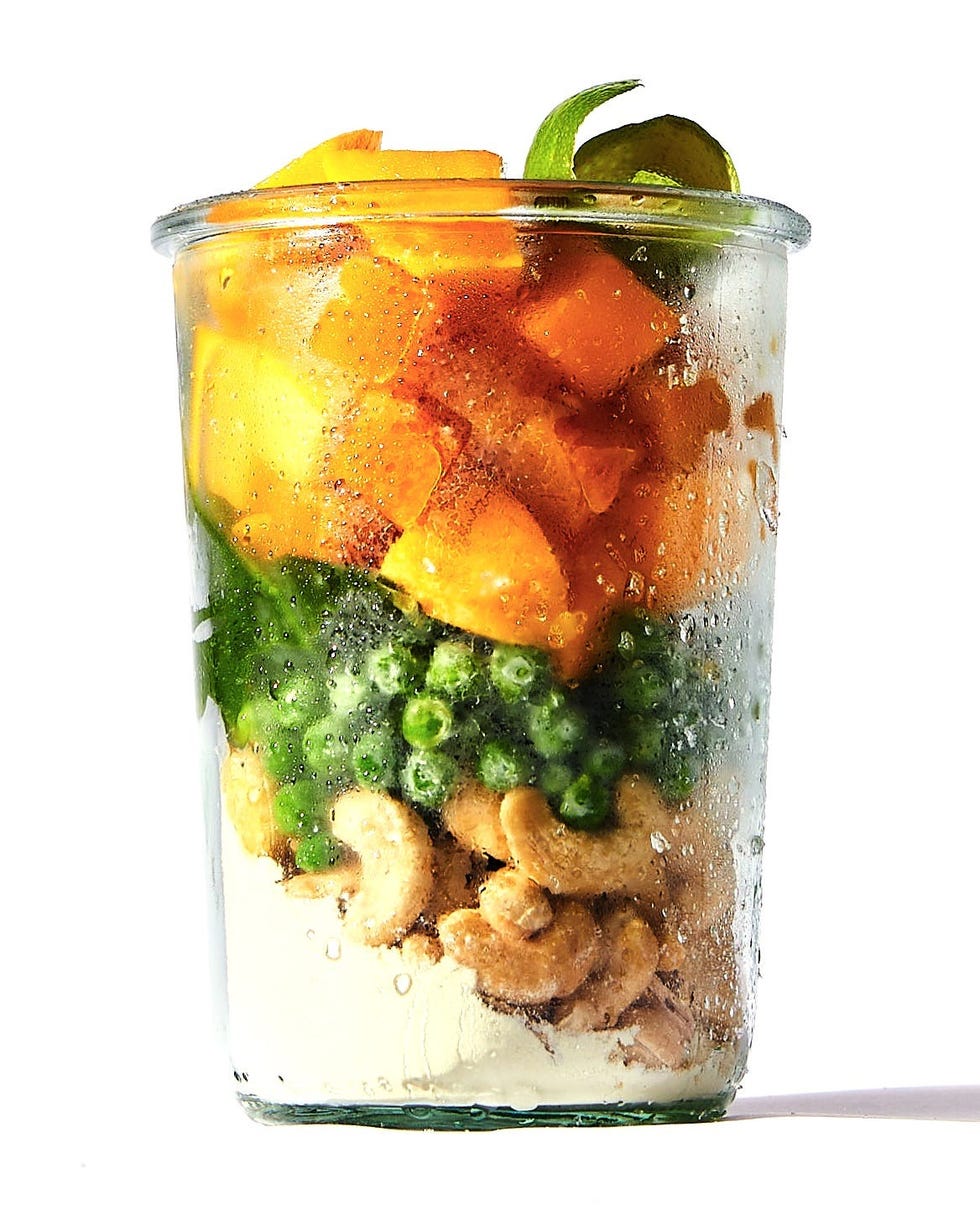 layered smoothie ingredients in a glass jar