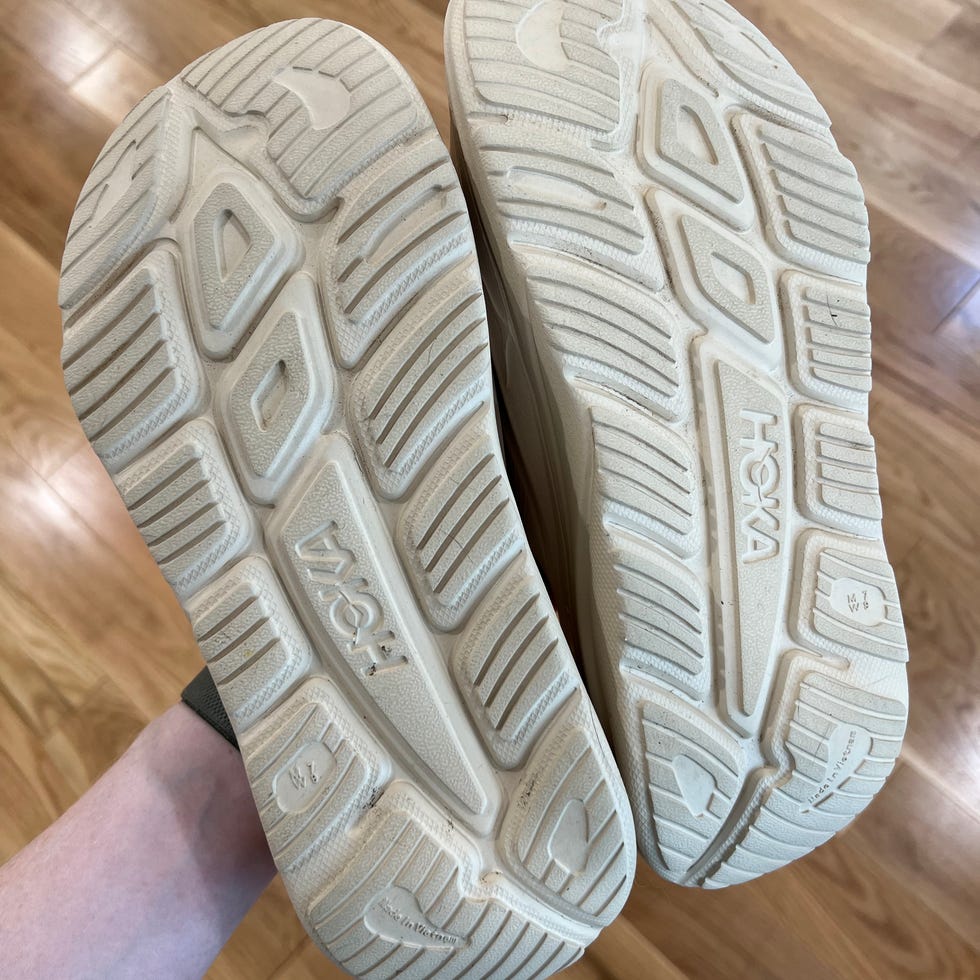 Close-up of the outsole of Hoka shoes showcasing the tread pattern and design.