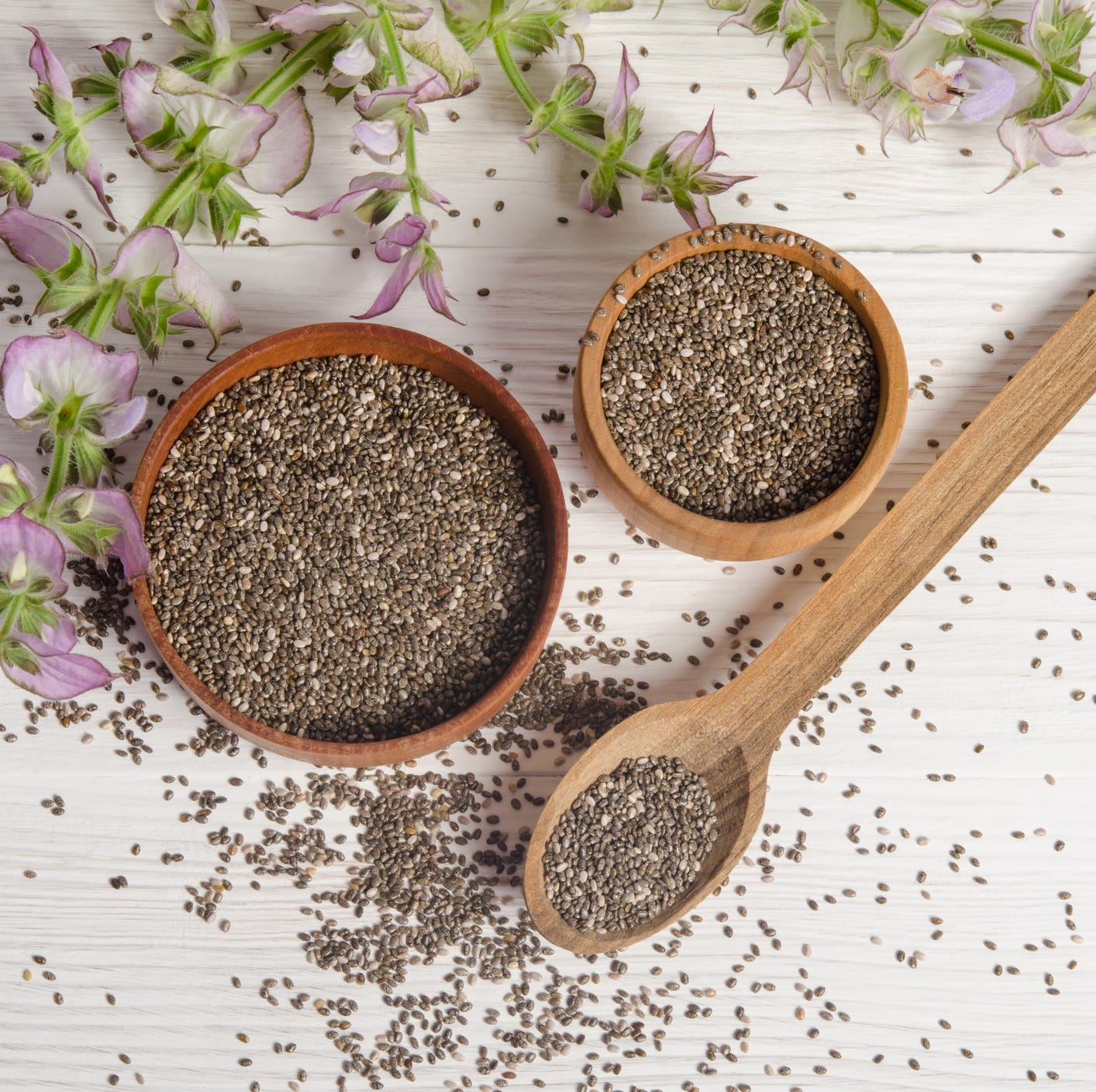 Chia seed healthy super food with flower over white
