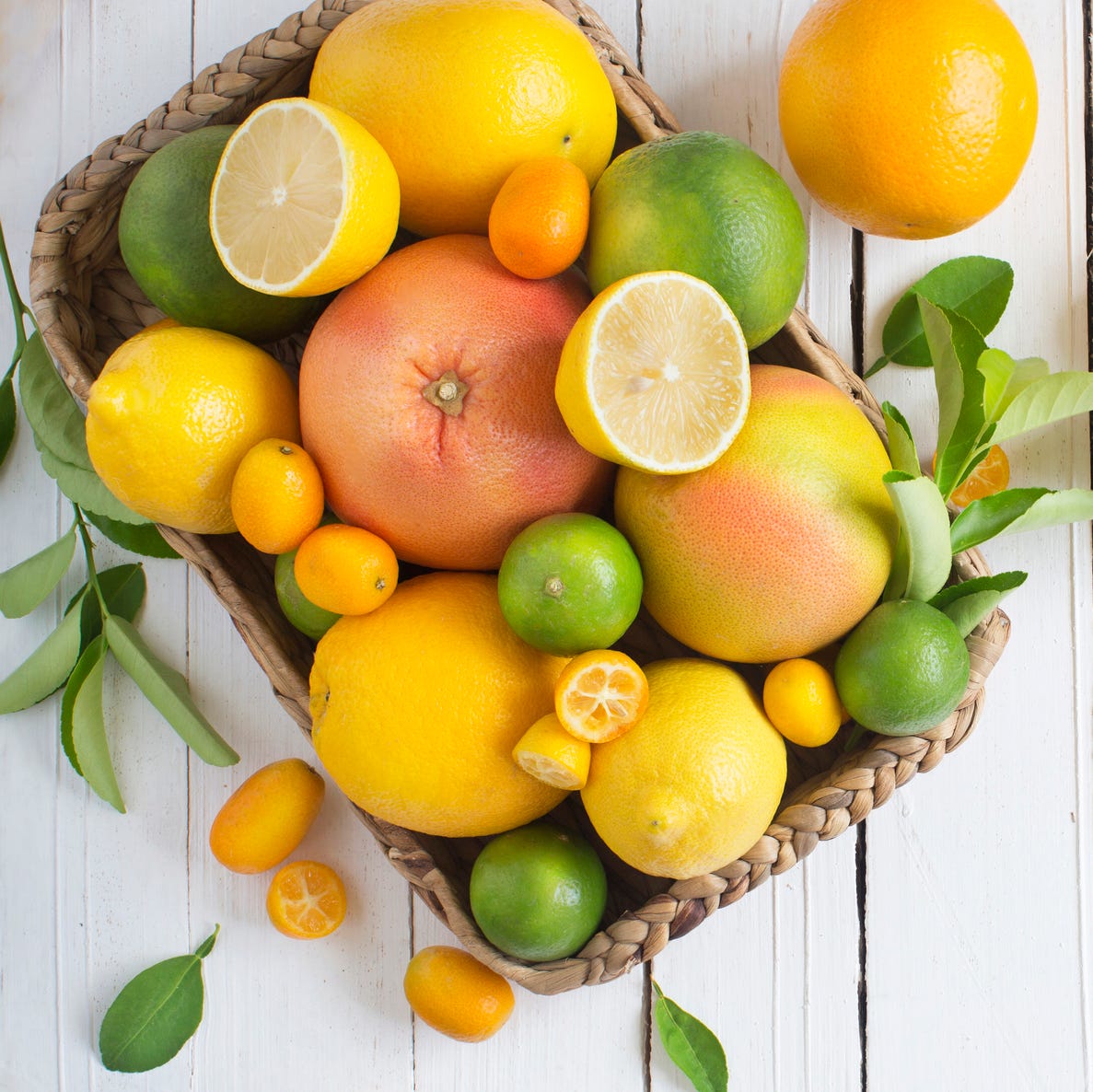 Citrus fruits family on rustic white wooden background. Horizontal view. Text space images. Citrus fruits family on rustic white wooden background. Horizontal view. Text space images.