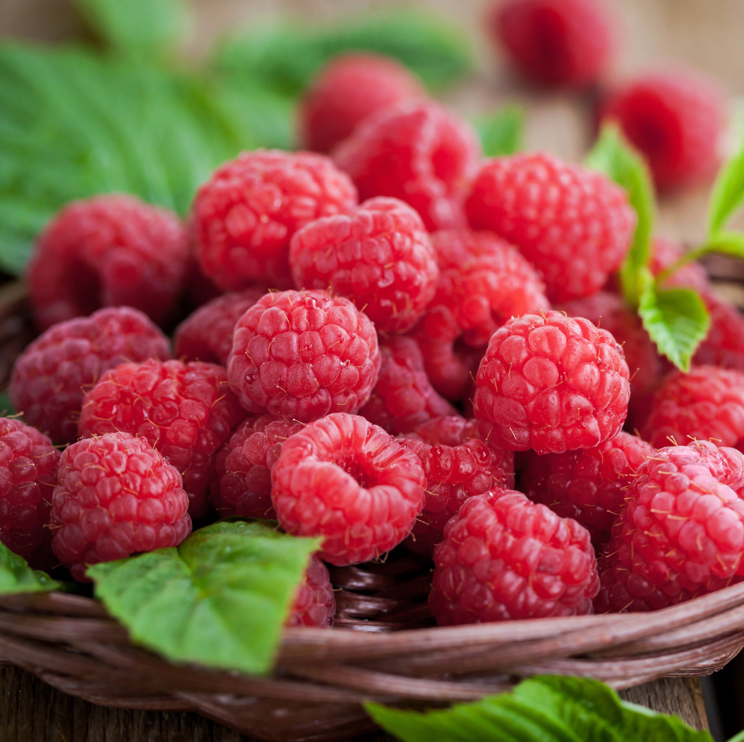 Ripe raspberry with leaf