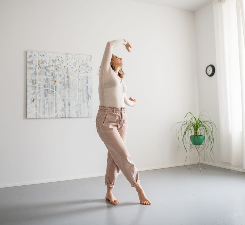 woman doing relaxation move exercises at home
